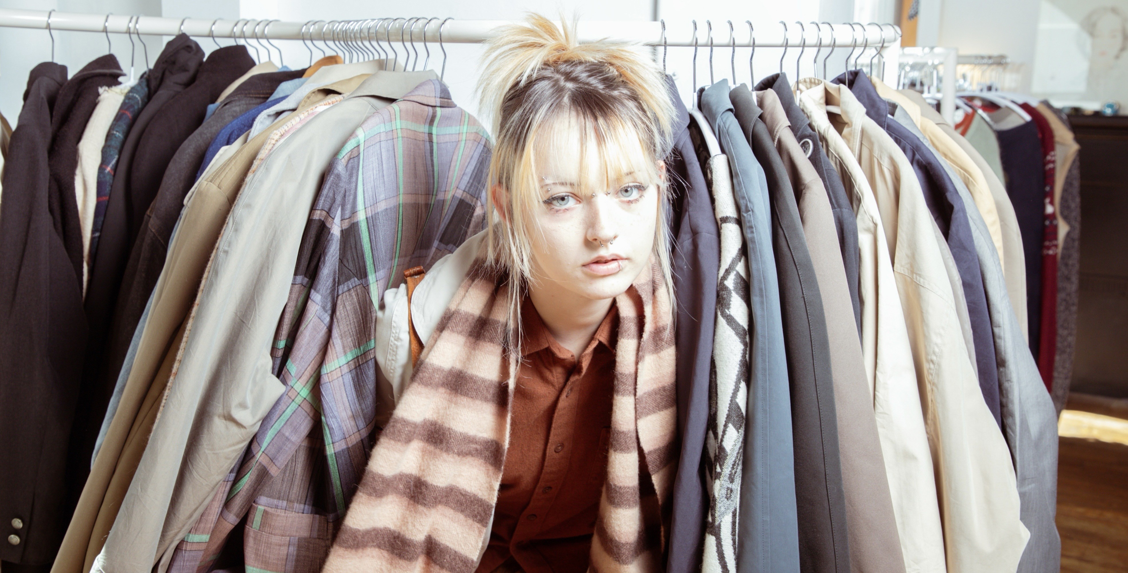 Rails of curated vintage garments inside the Seth Mater archive